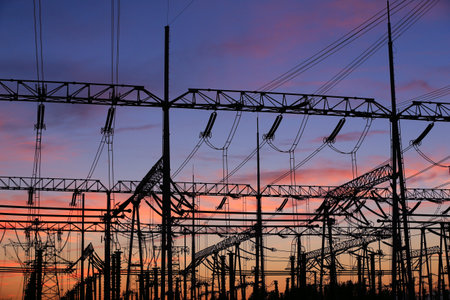 High voltage power grid, in the sunsetの写真素材