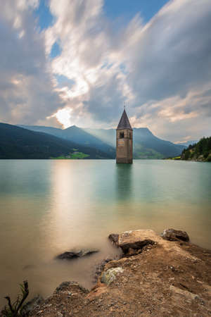 Curon bell tower landscape, Resia Lake, Italyの写真素材