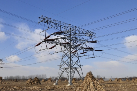Under the blue sky of high-voltage electric tower  の写真素材