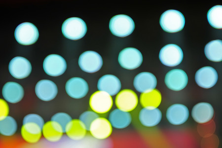 The bokeh light in the dark, the abstract backgroundの写真素材