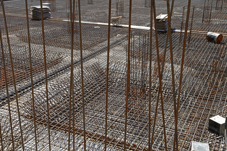 worker in the construction site making reinforcement metal framework for concrete pouringのeditorial素材
