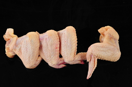 Chicken wings on a black backgroundの写真素材