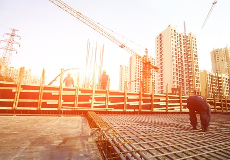 workers in the construction site making reinforcement metal framework for concrete pouringのeditorial素材