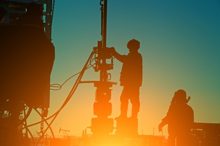 Oil drilling exploration, the oil workers are workingのeditorial素材