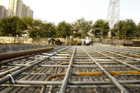 worker in the construction site making reinforcement metal framework for concrete pouringのeditorial素材