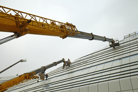 Construction workers in mobile hydraulic construction platformのeditorial素材