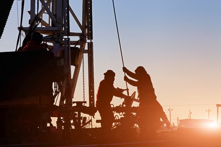 Oil drilling exploration, the oil workers are workingのeditorial素材