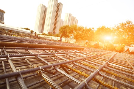 worker in the construction site making reinforcement metal framework for concrete pouringのeditorial素材