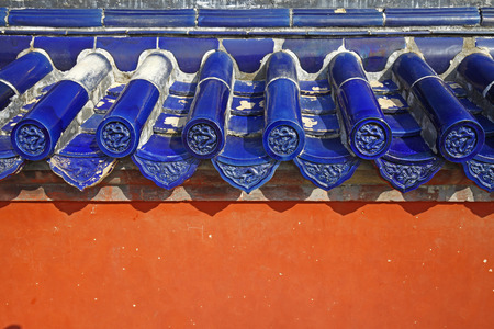 The blue glazed tiles on the wall as the background, the traditional architectureのeditorial素材
