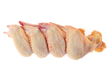 Raw chicken wings on a white backgroundの写真素材