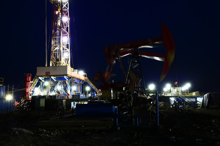 Oil drilling rig in the eveningの写真素材