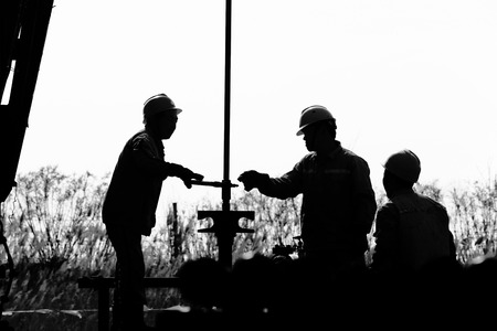 the oil workers are workingの写真素材