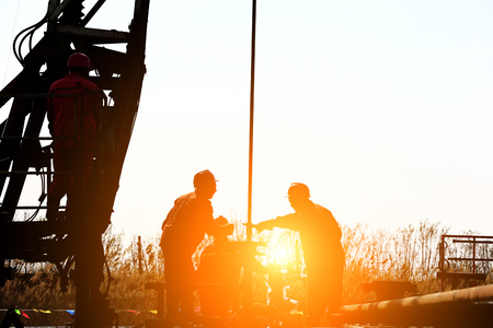 the oil workers are workingのeditorial素材