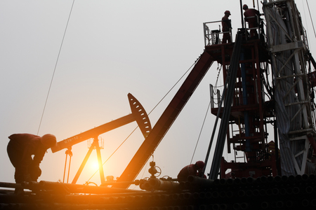 Oil drilling exploration, the oil workers are workingのeditorial素材