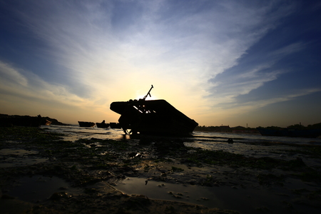 Docked ship landscape view during sunsetの写真素材