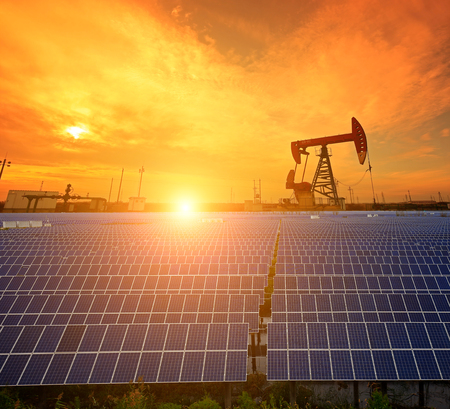 Oil pump with solar panels and the sunsetのeditorial素材