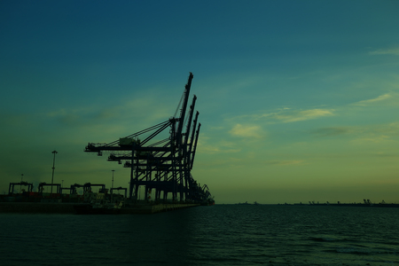 Port crane unloading container shipsの写真素材