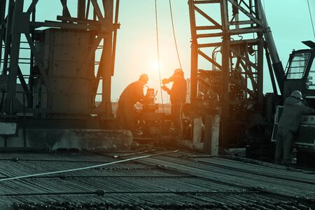 Oil drilling exploration, the oil workers are workingの写真素材