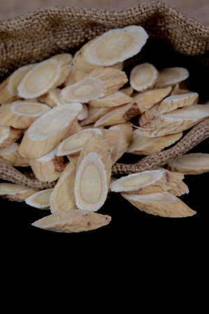 Chinese herbal medicine astragalus membranaceus on a white background, close-up pictures