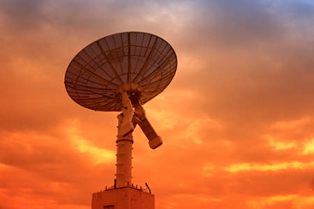 The silhouette of a radio telescope observatoryの写真素材