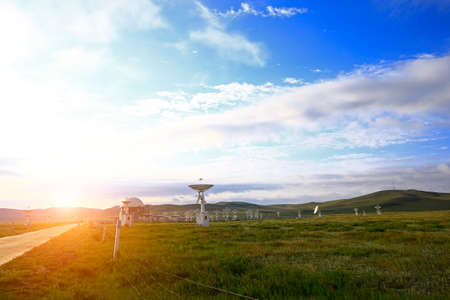 Radio telescope observatory and the blue sky white cloudsの写真素材