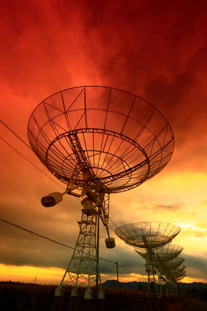 The silhouette of a radio telescope observatoryの写真素材