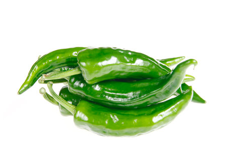 Fresh green chilies on white backgroundの写真素材