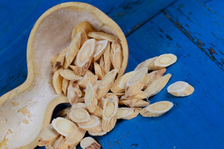 Chinese herbal medicine astragalus membranaceus on a white background, close-up pictures