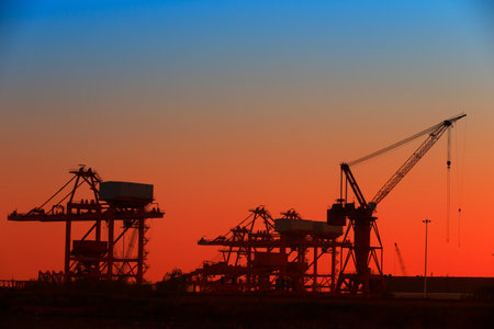 Port crane unloading container shipsの写真素材