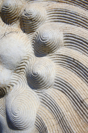 Vintage ornament on the stone. Close-up seamless texture. Stone texture. Pattern on the stone....