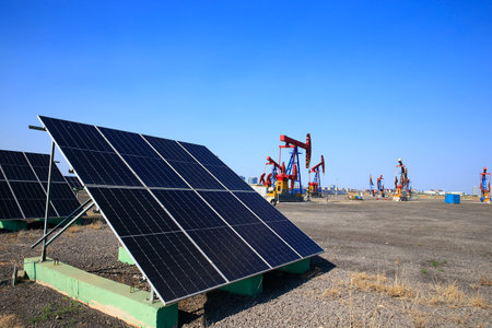 Oil pump, natural gas processing plant, with wind turbine, solar panel, industrial concept, energy...