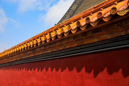 The yellow glazed tiles on the wall as the background, the traditional architecture, Very elegantの写真素材