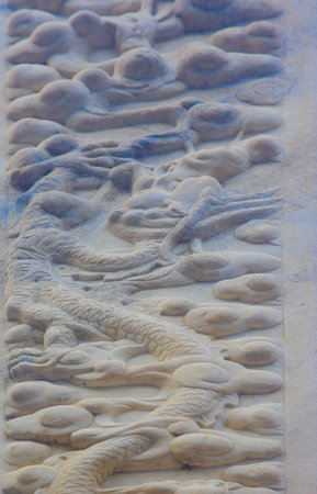 Vintage ornament on the stone. Close-up seamless texture. Stone texture. Pattern on the stone. Embossed pattern.の写真素材
