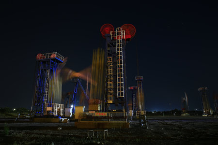 Pump platform for oil production in oil field at night.Oil and gas industry.の写真素材
