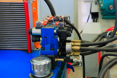 Close-up of metal bolts and nuts on industrial machinery in manufacturing facilities