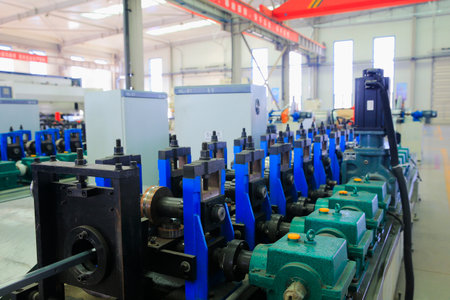 Close-up of metal bolts and nuts on industrial machinery in manufacturing facilities