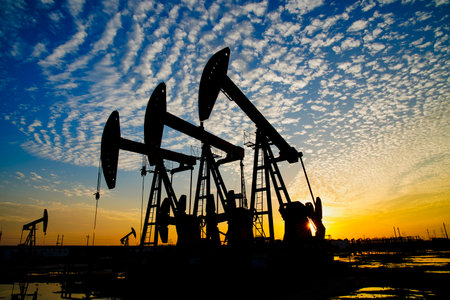 The oil pump, industrial equipment. Oil field site, oil pumps are running, Extraction of oil.の写真素材