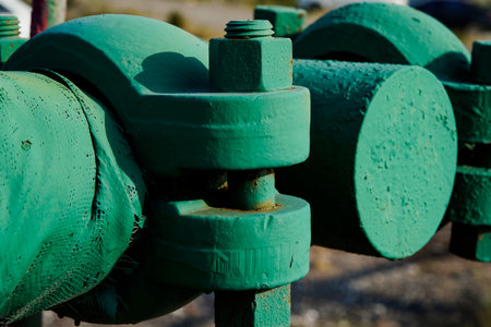 Close-up of metal bolts and nuts on industrial machineryの写真素材