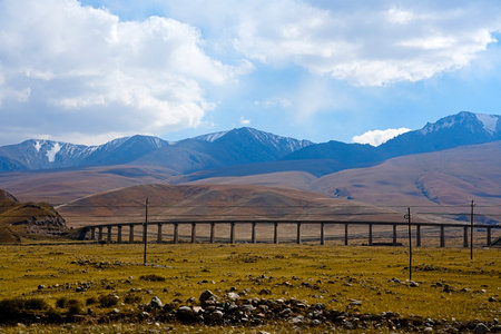A sunny summer, a vast panoramic view of alpine meadows and natural grasslands.の写真素材