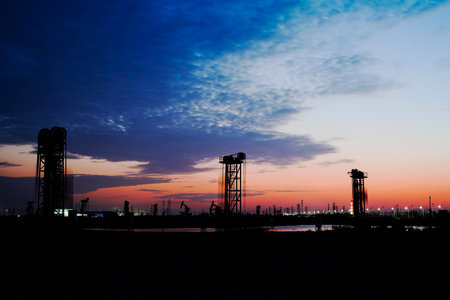 The oil pump, industrial equipment. Oil field site, oil pumps are running, Extraction of oil.の写真素材