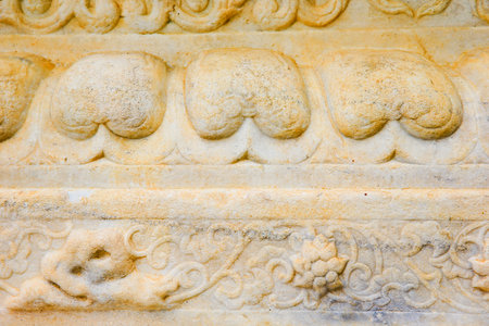 Vintage ornament on the stone. Close-up seamless texture. Stone texture. Pattern on the stone. Embossed pattern.の写真素材