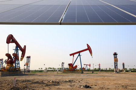 Oil pumps and solar panels, industrial equipmentの写真素材