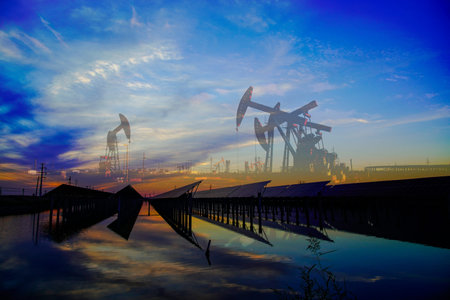 Oil pumps and solar panels, industrial equipmentの写真素材