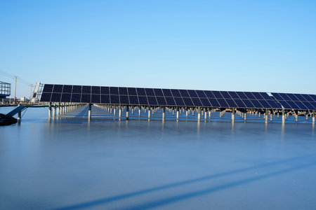 The power plant has rows of solar photovoltaic panels for producing clean electricity. The concept...