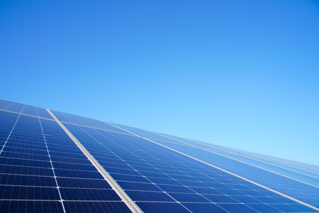 The power plant has rows of solar photovoltaic panels for producing clean electricity. The concept...