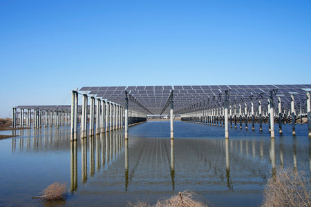 The power plant has rows of solar photovoltaic panels for producing clean electricity. The concept...