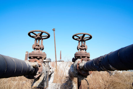 Oil and gas processing plant with pipe line valves.Steel pipelines and valves.Oil pipeline valves in...