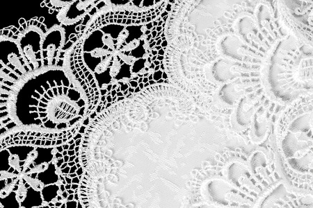 white lace on black background. cloth patternの写真素材