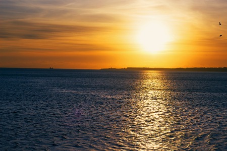 Beautiful sunset over the oceanの写真素材