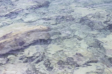 Sea surface with ripples and waves, beautiful pattern of blue water